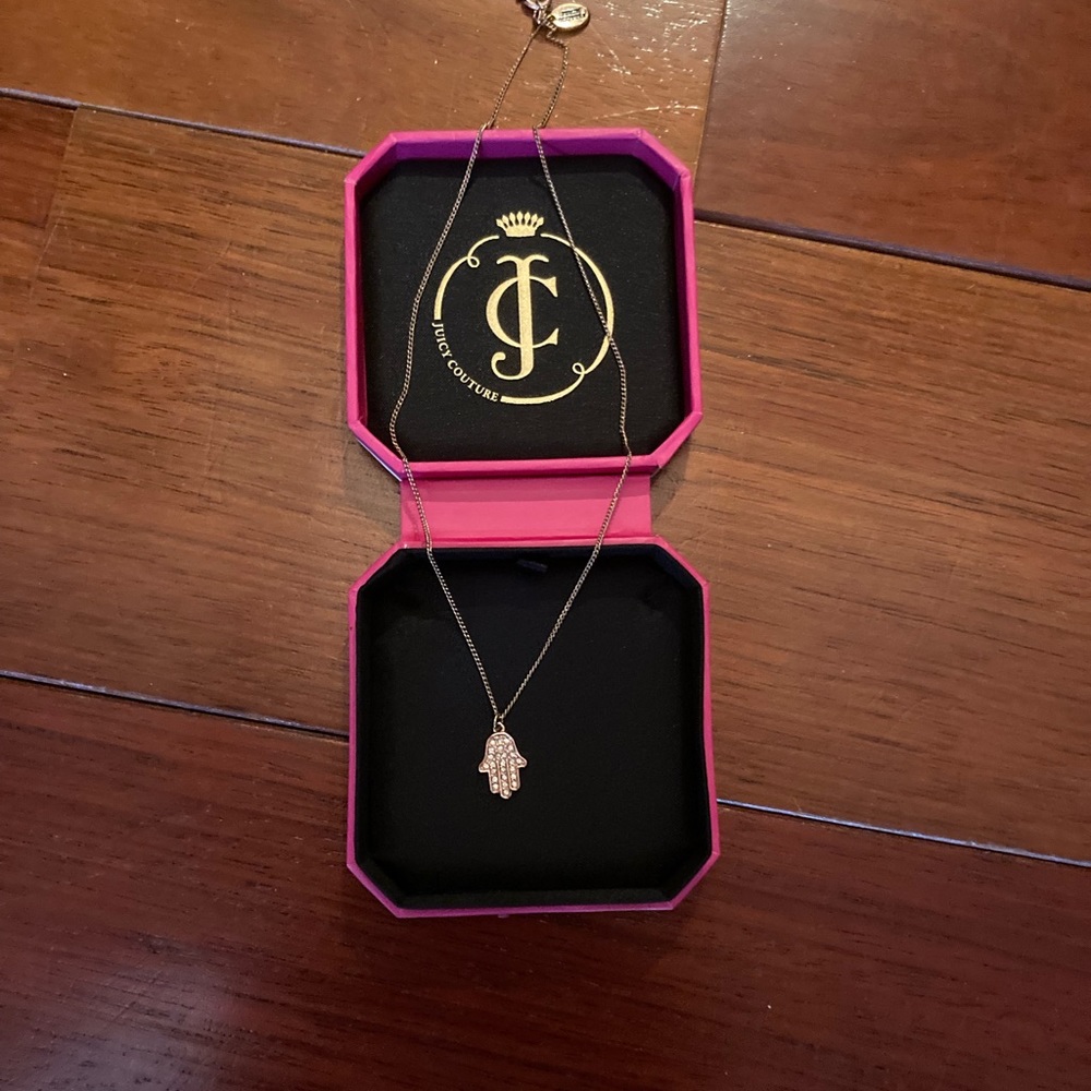 Juicy Couture rose gold hamsa necklace.